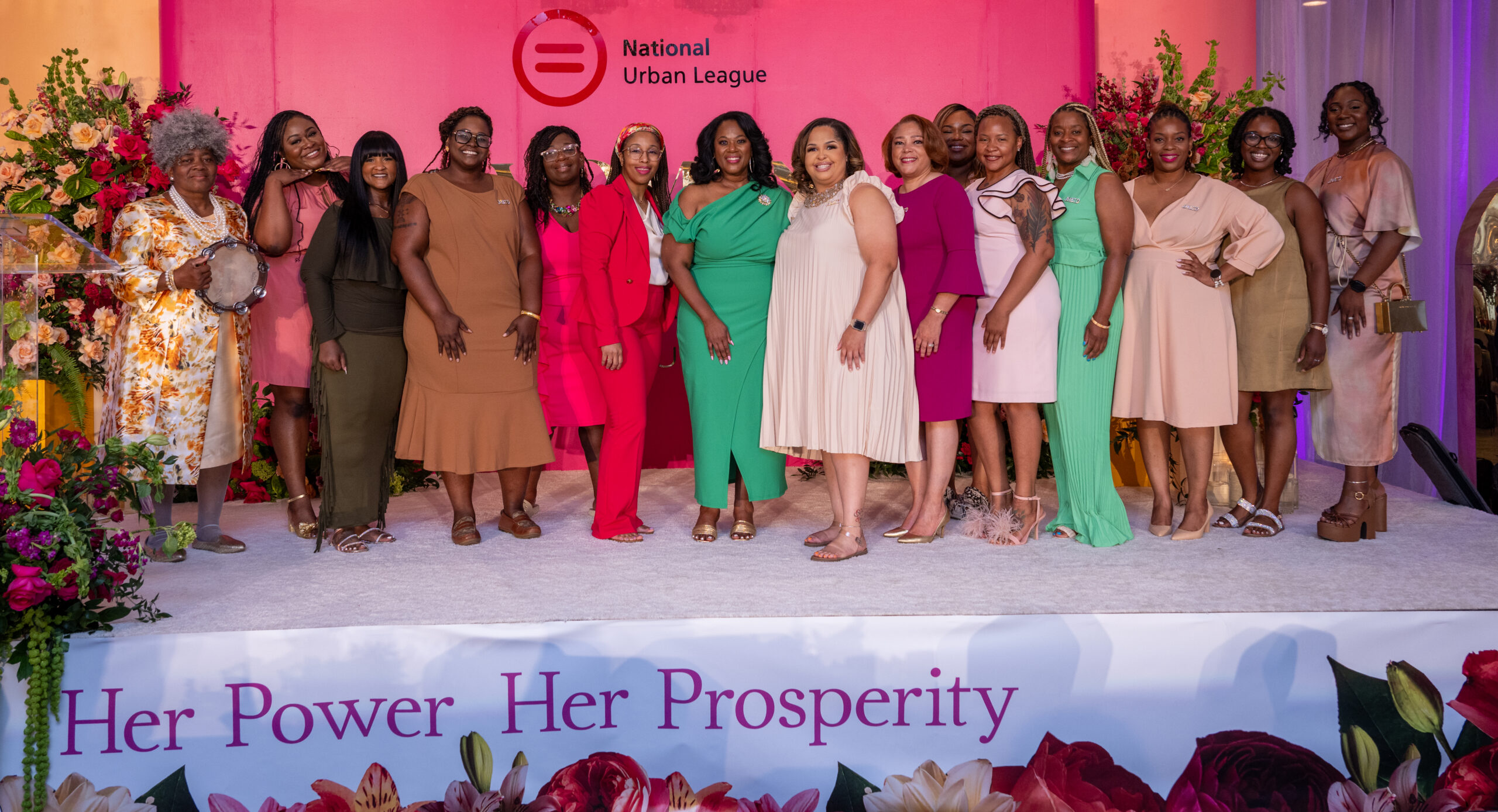 A group of diverse women standing together at a National Urban League event.
