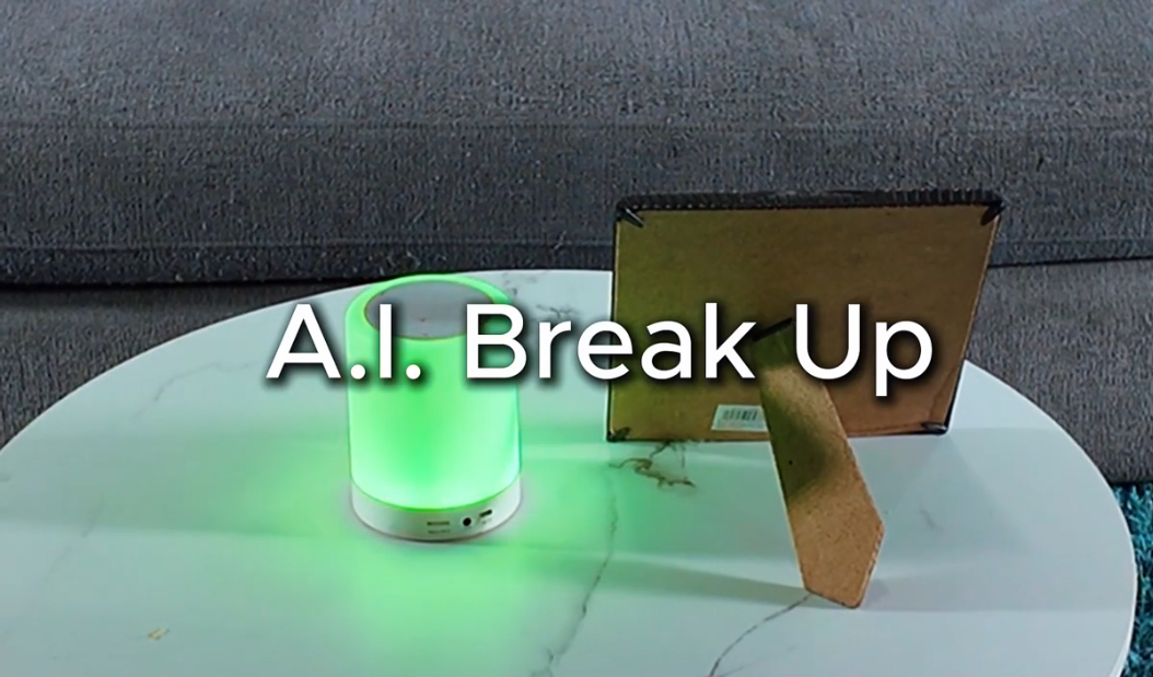 A glowing green lamp with a reflective surface and a small sign beside it.